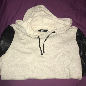 Grey hooded sweatshirt with leather sleeves