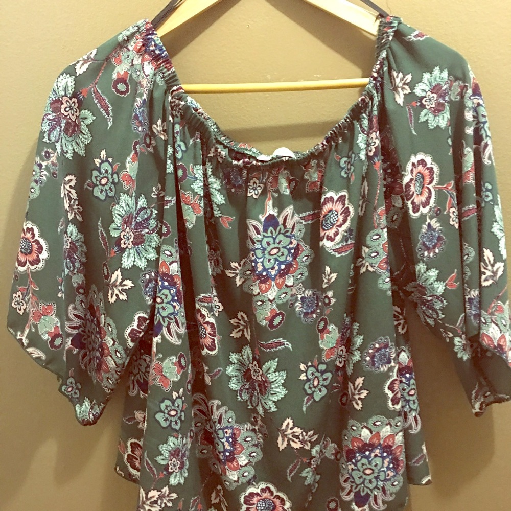 Floral blouse hangs of the shoulders