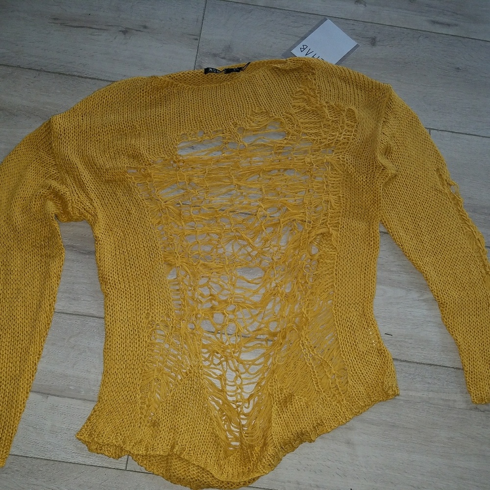 Gold knitted sweater.
