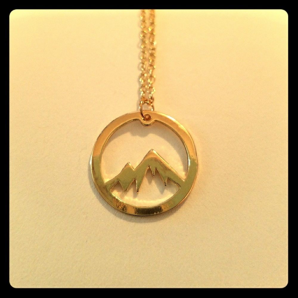 Gold plated mountain medallion necklace
