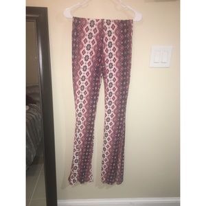 Flared out pants. Stretchy material. Form fitting