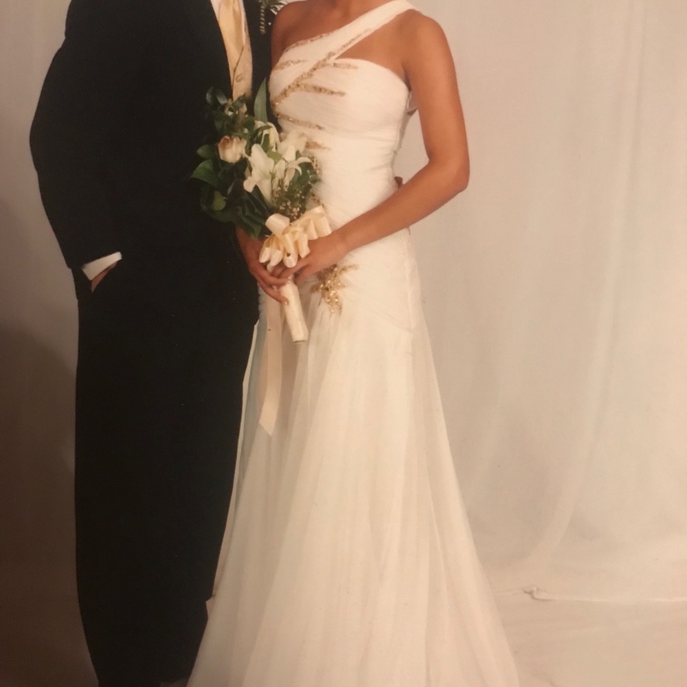 White gown with gold embellishments