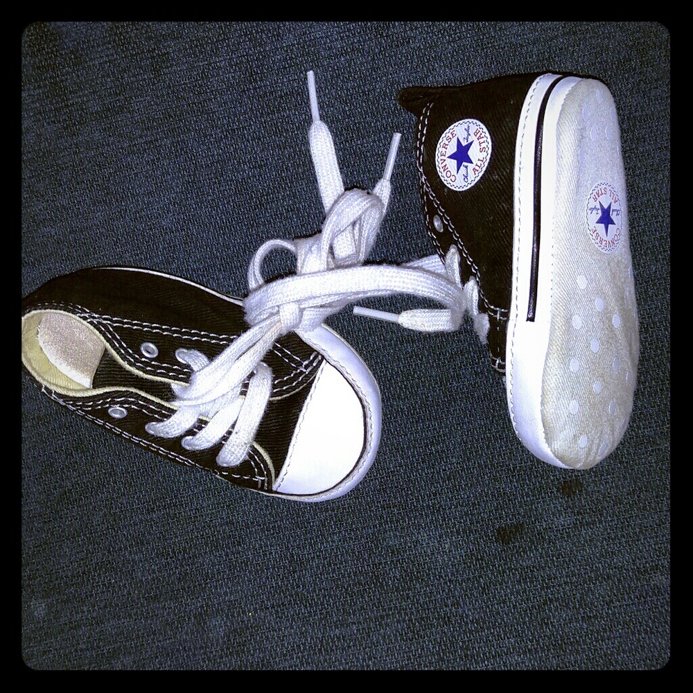 Black hightop baby converse.