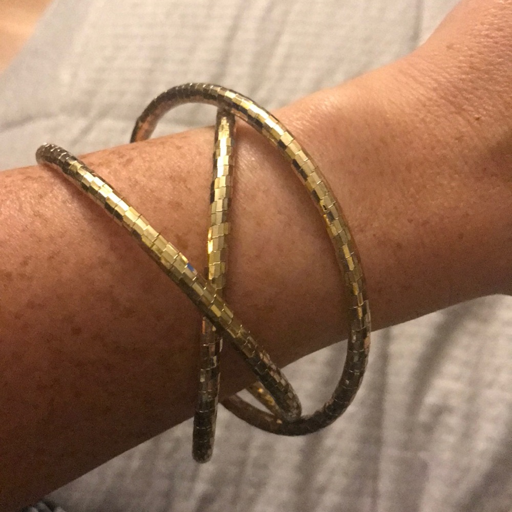 Gold tone bangle bracelet.