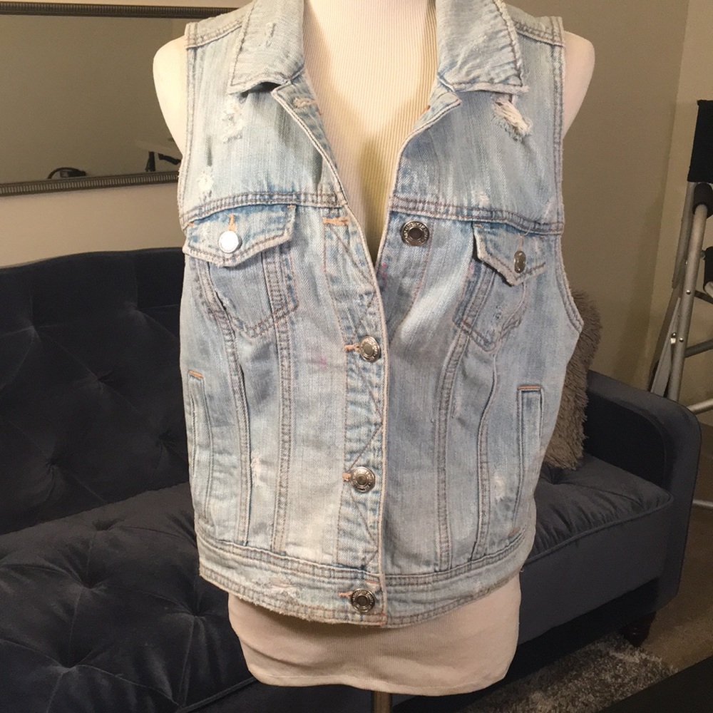 Distressed denim vest