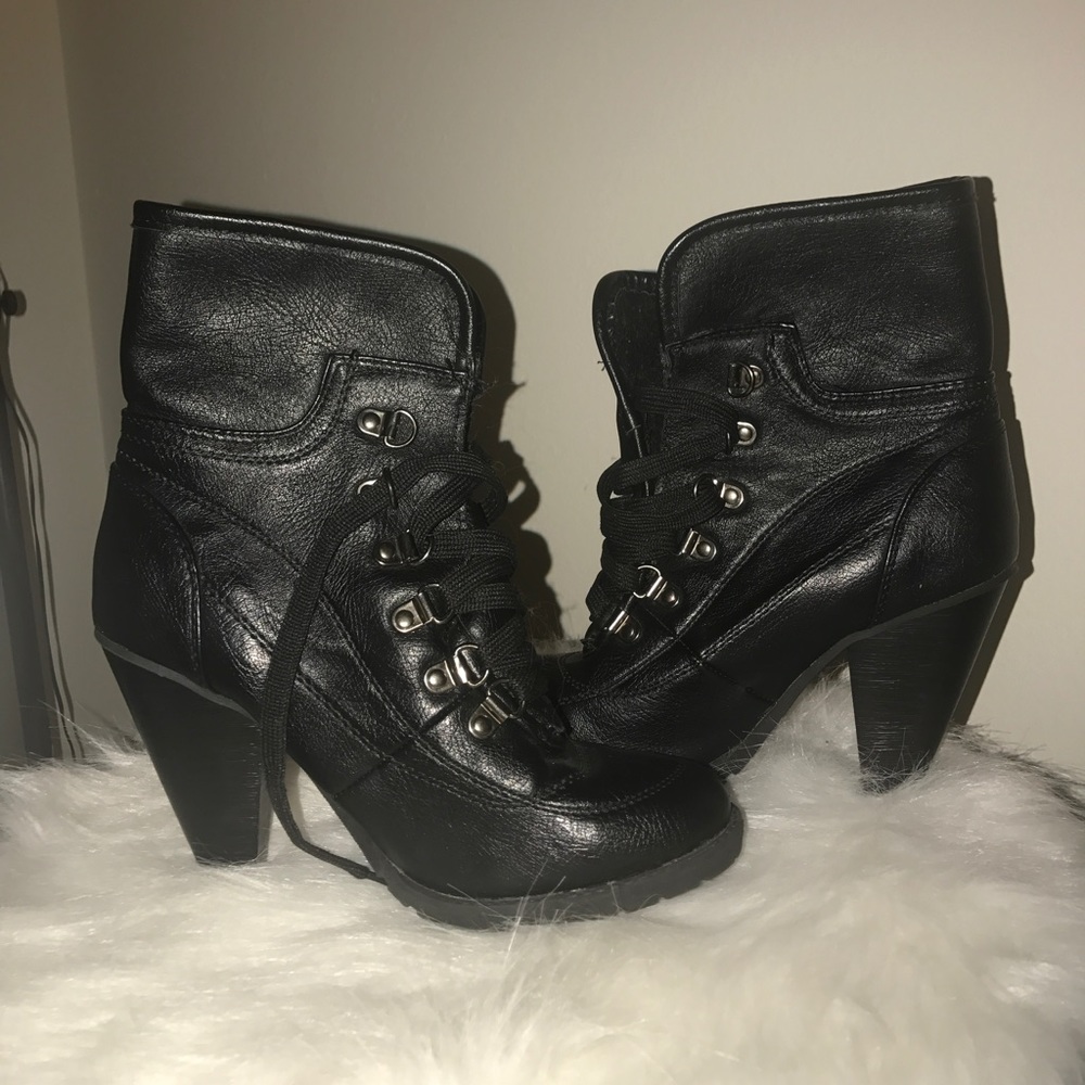 Black heeled boots with front laces