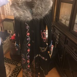 Long sweater jacket with details.