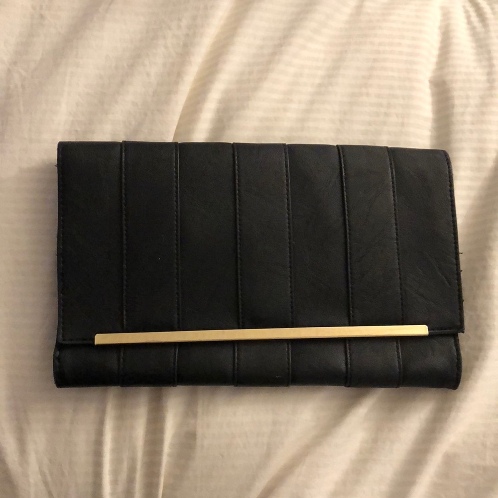 Black clutch w/ gold strip