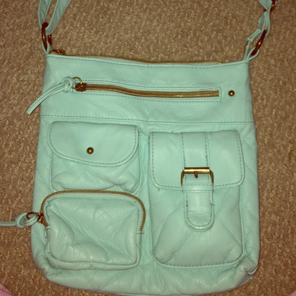 Claire’s teal leather over the shoulder purse!