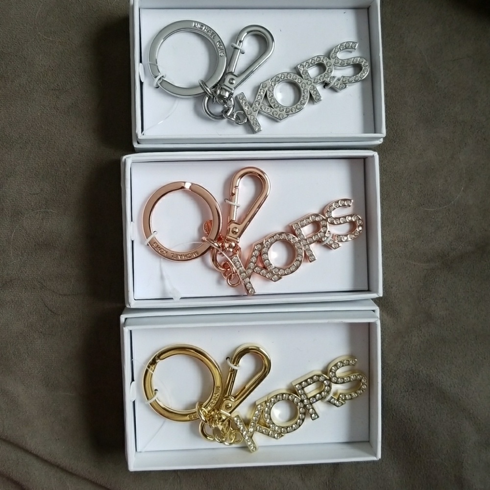 3 Michael Kors key fobs/charms