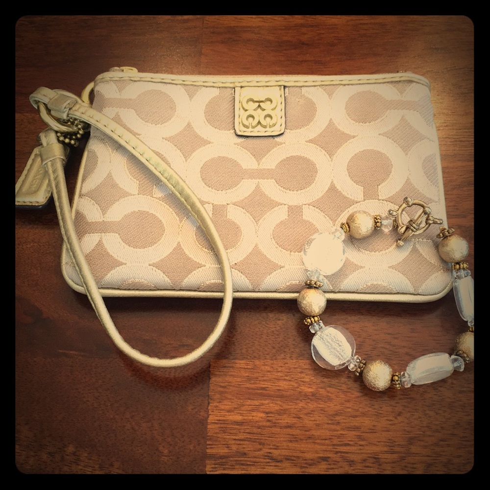 Authentic Coach gold wristlet