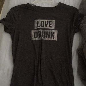 dark grey t shirt , short sleeved , “love drunk”