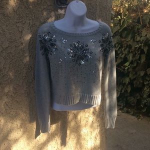 A grey justice sweater