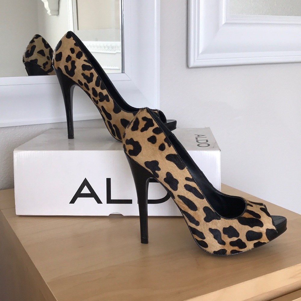 Aldo brand cheetah peep toe heels.