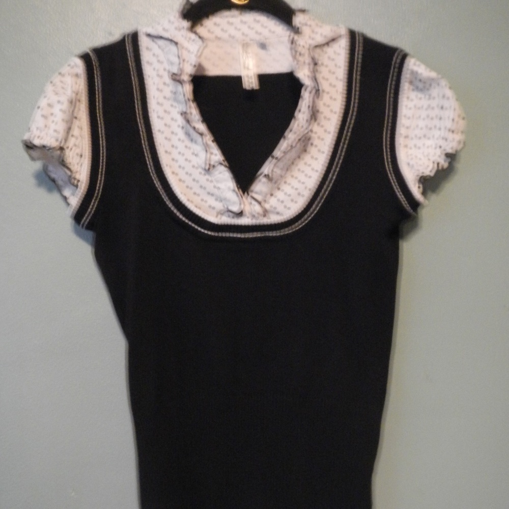 Super cute black top with white polka dot accents