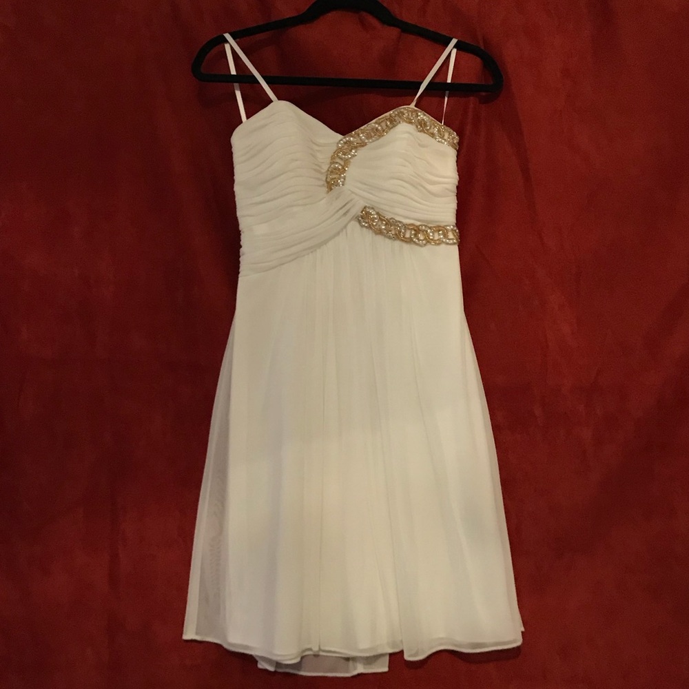 Formal white detailed and gold beaded dress.