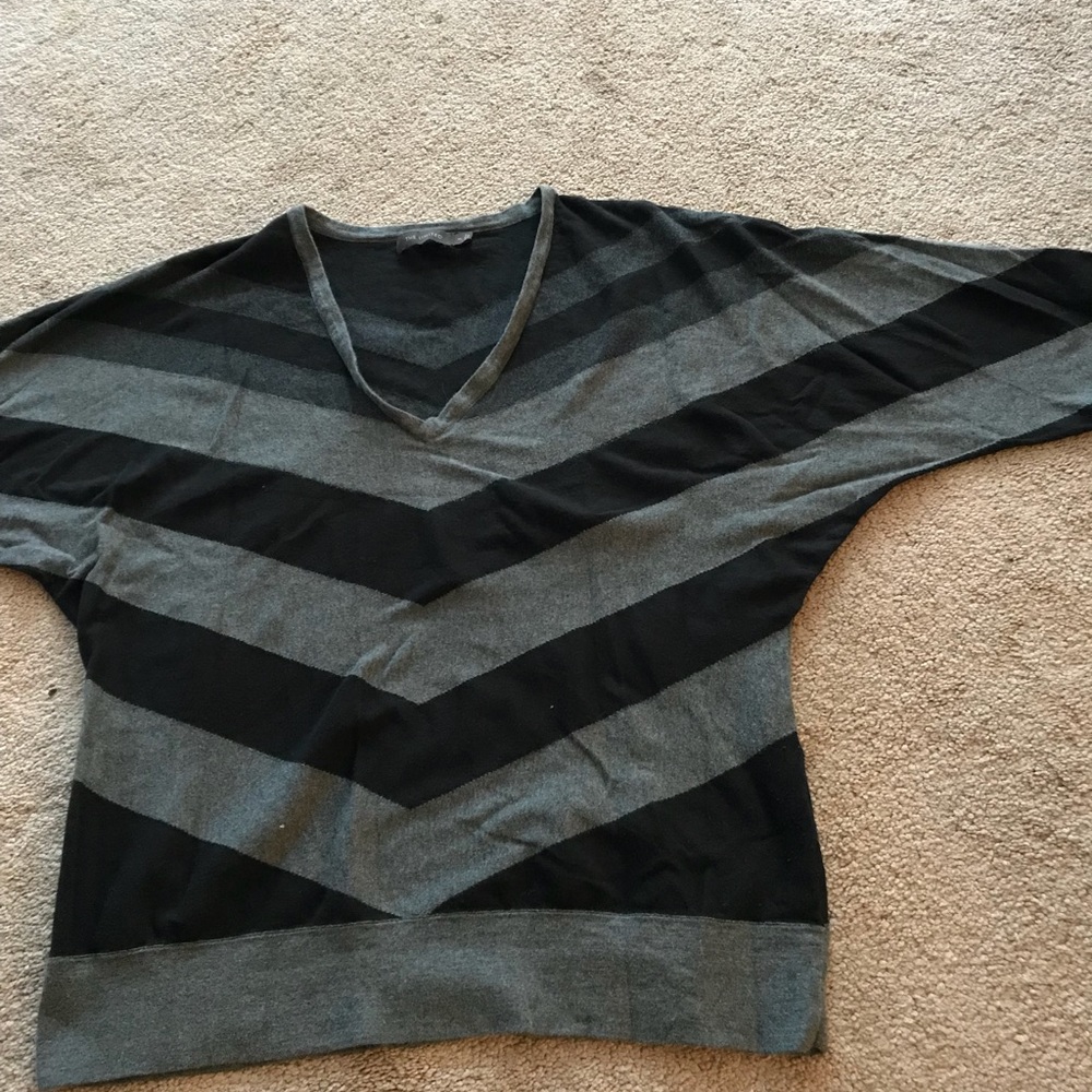 Gray and black striped sweater with banded bottom