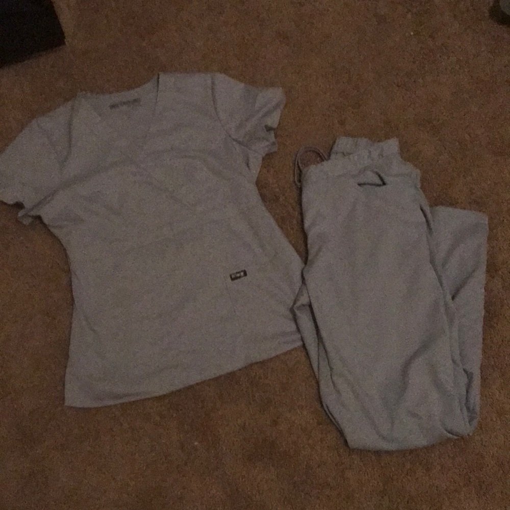 Grey’s Anatomy light gray Scrubs.