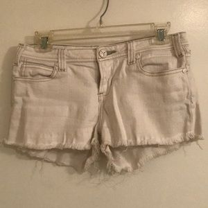 White distressed shorts
