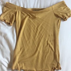 Off the shoulder mustard yellow top.