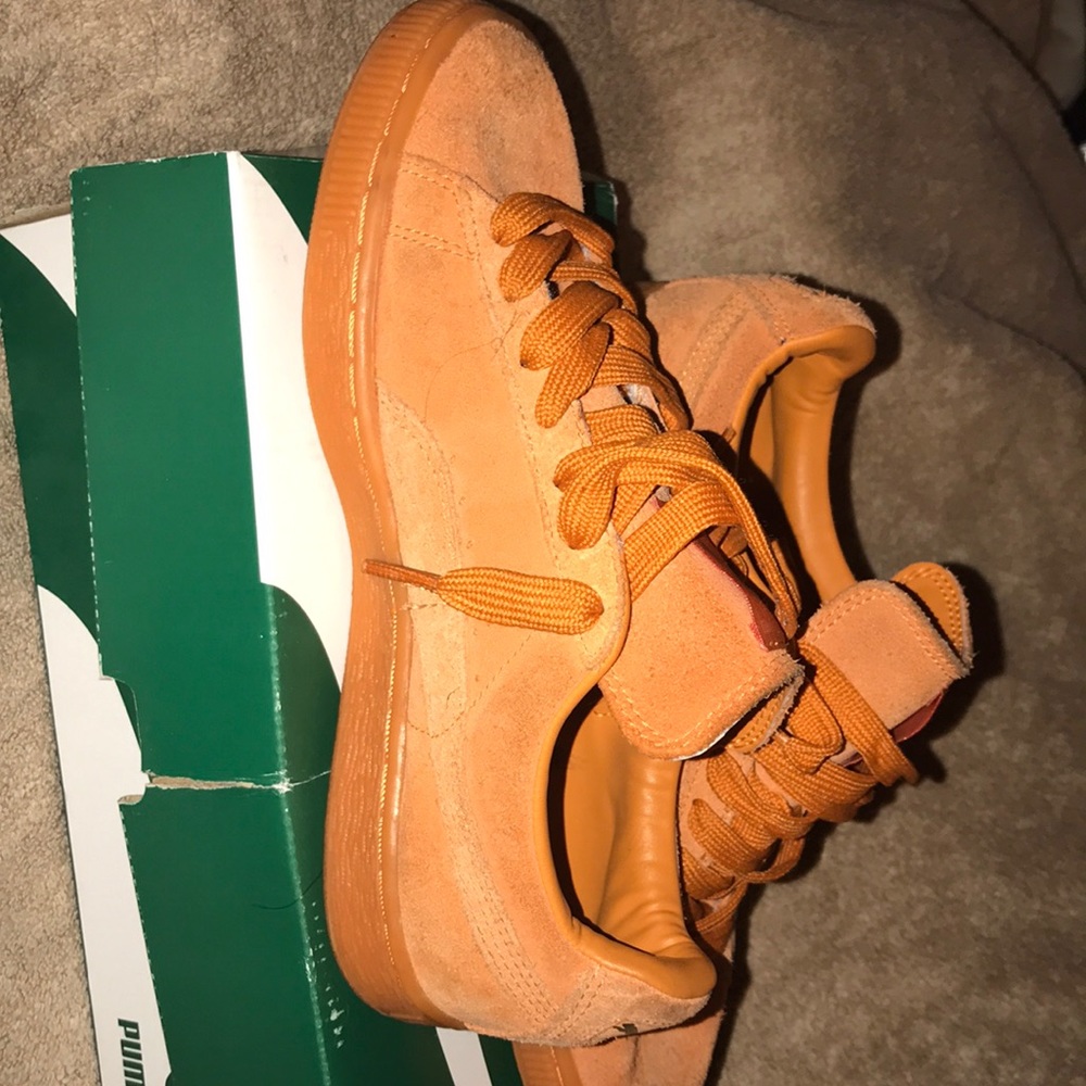 Orange puma sneakers