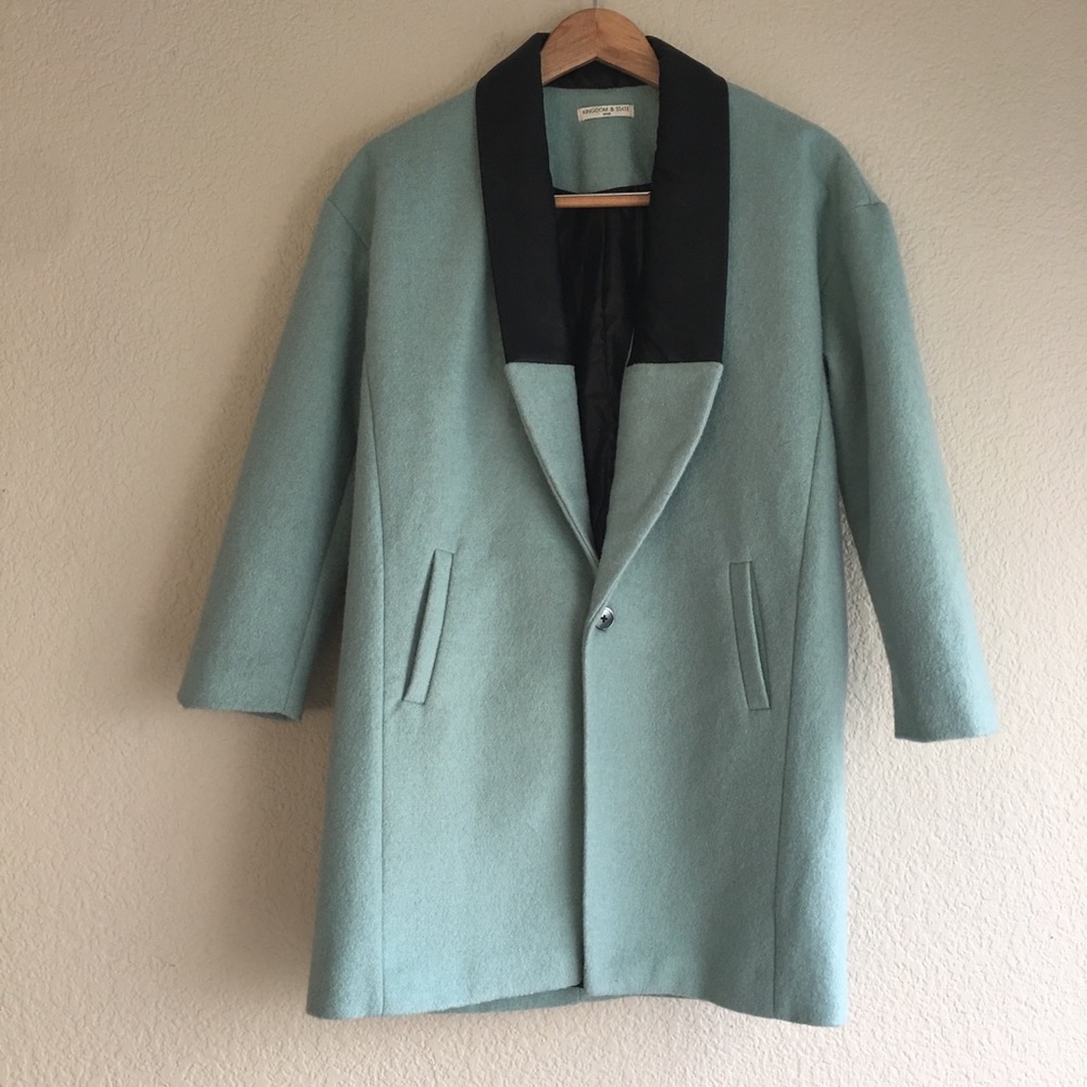 Blue coat from Tan France of Queer Eye’s label