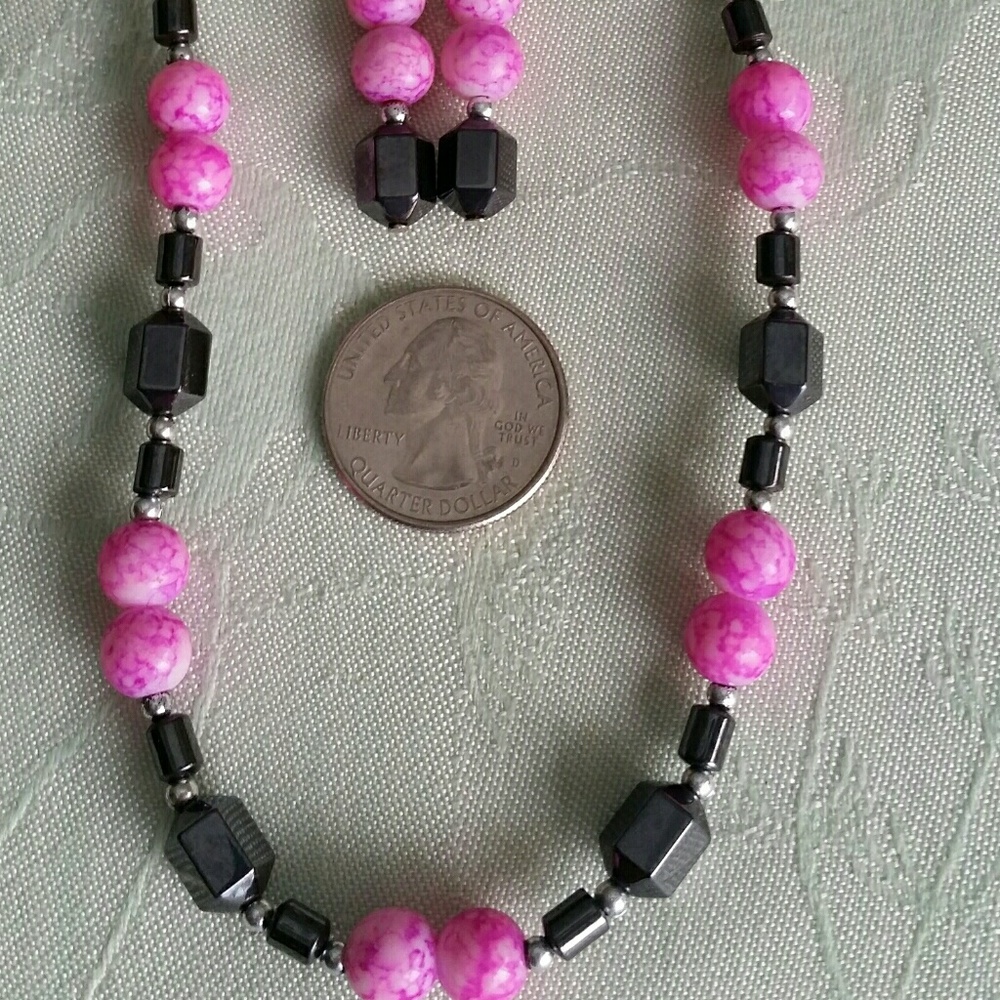 Black and pink necklace with earrings.
