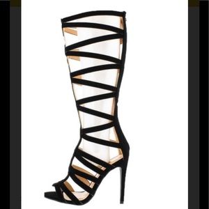 Black strapped heel boot