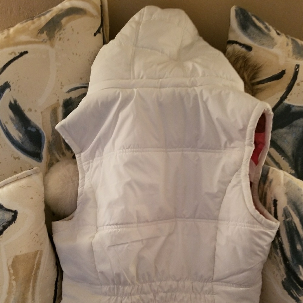White vest with fur around the hood