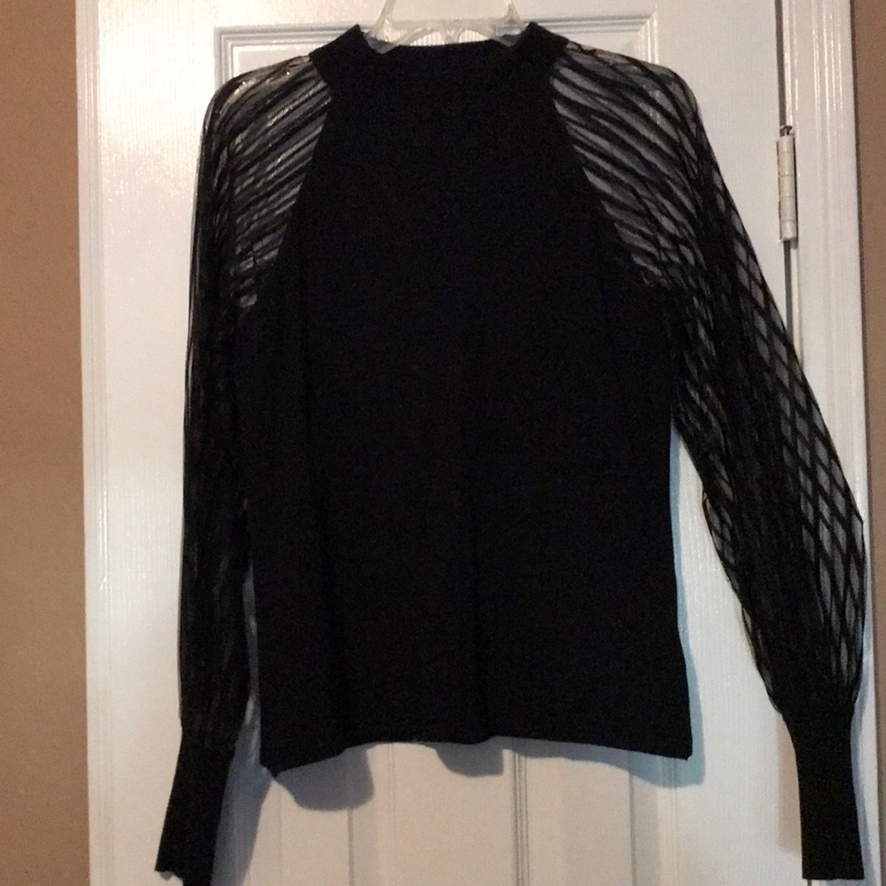 Francesca’s black blouse