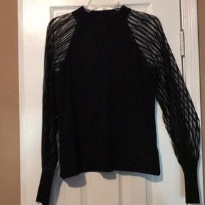 Francesca’s black blouse
