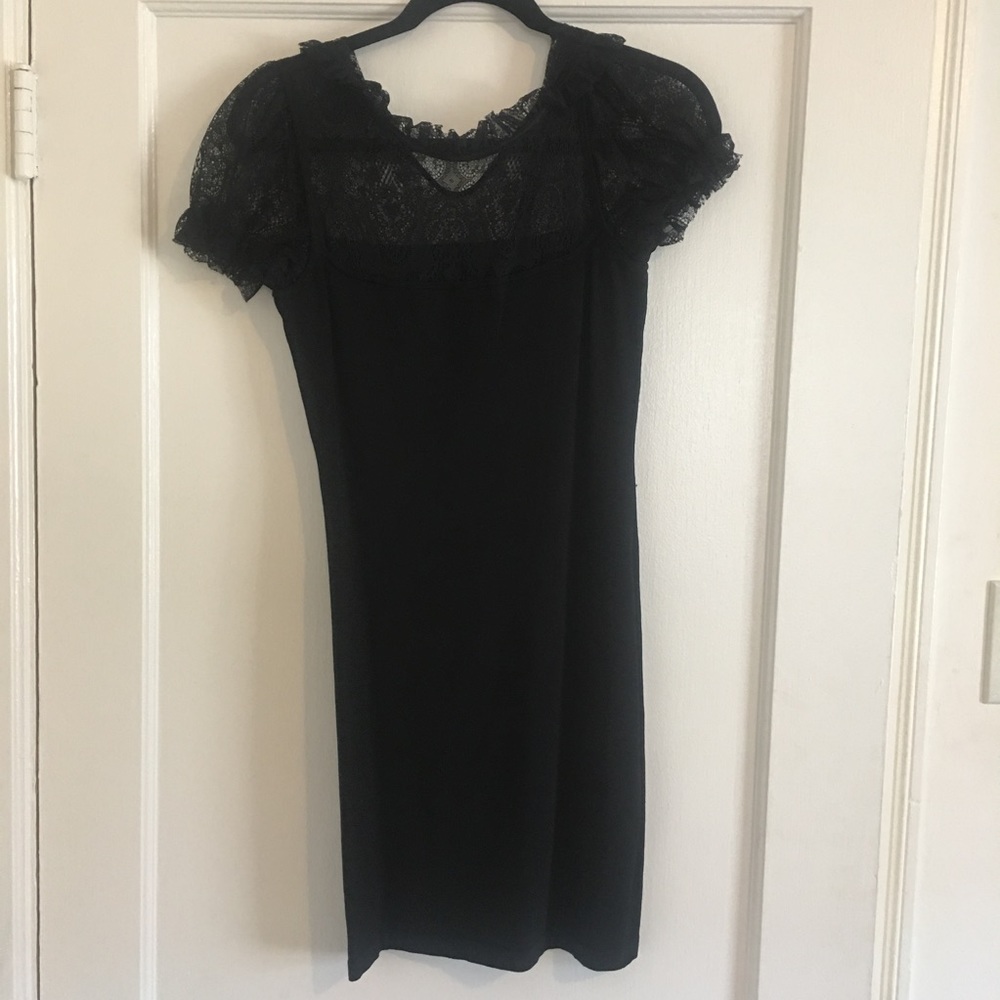 BEBE Beautiful black dress. Bodycon dress with lace on top. Some snags