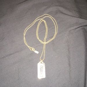 Coach dog tag