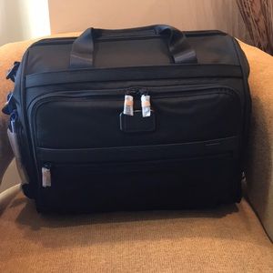 Brand new, still wrapped Tumi Framed Duffel bag.