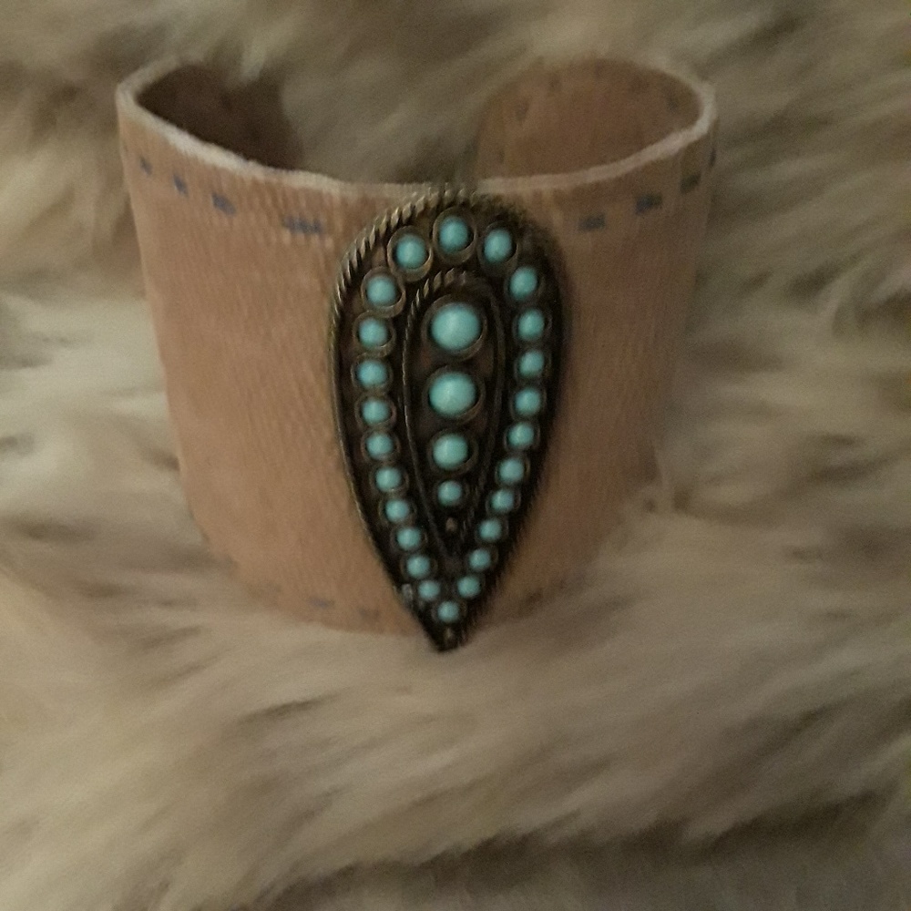 Brown suede cuff w/ turquoise emblem
