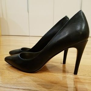 Black leather pumps