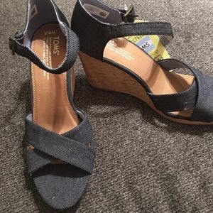 NWT. Blue jean TOMS wedges. Never worn