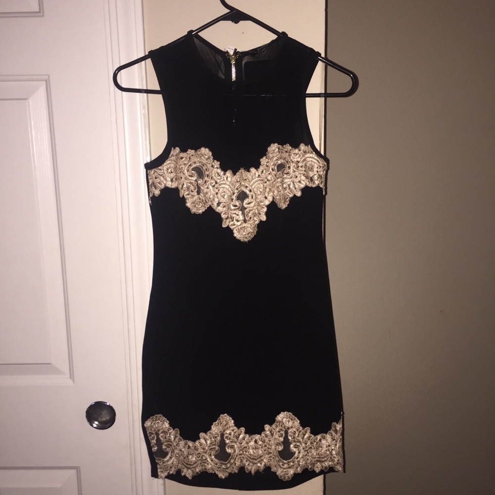 Black dress with sheer tops with gold details