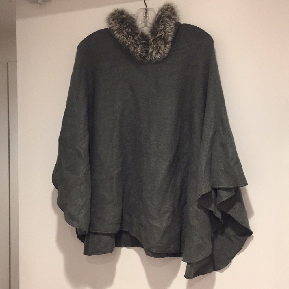 Grey knit cape with fur trimmed hood