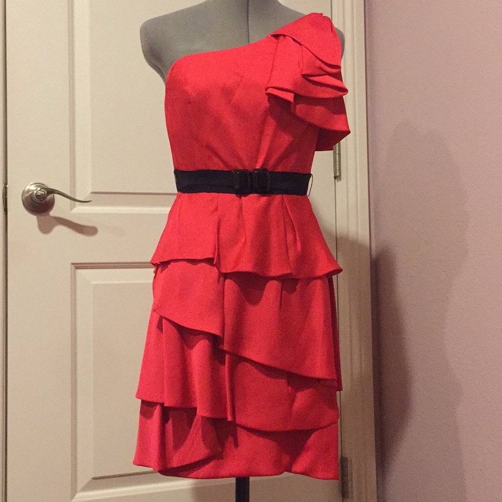 Red one shoulder ruffled dress with black belt.