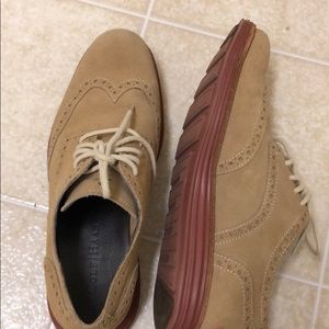 Suede tan oxfords with reddish brown sole