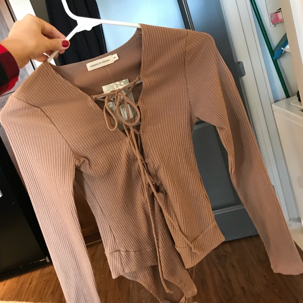 Nude lace up long sleeved bodysuit. XS. NWT!!