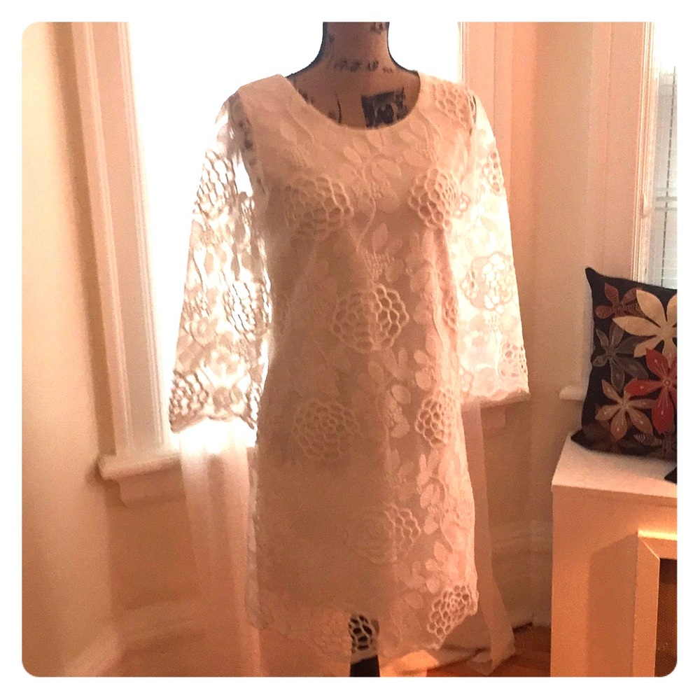 Classic white sheath dress with floral lace.