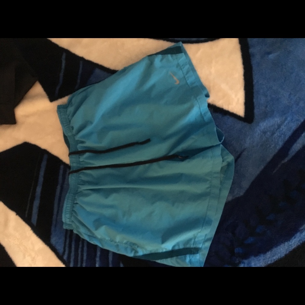 Blue Nike Running Shorts.