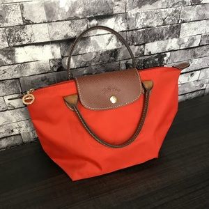 Longchamp Le Pliage orange mini tote