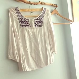 White top with dark and light blue pattern