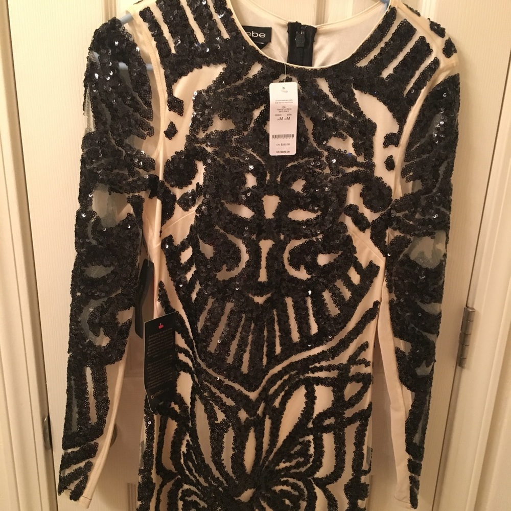 New with tags, black sequined dress from Bebe.