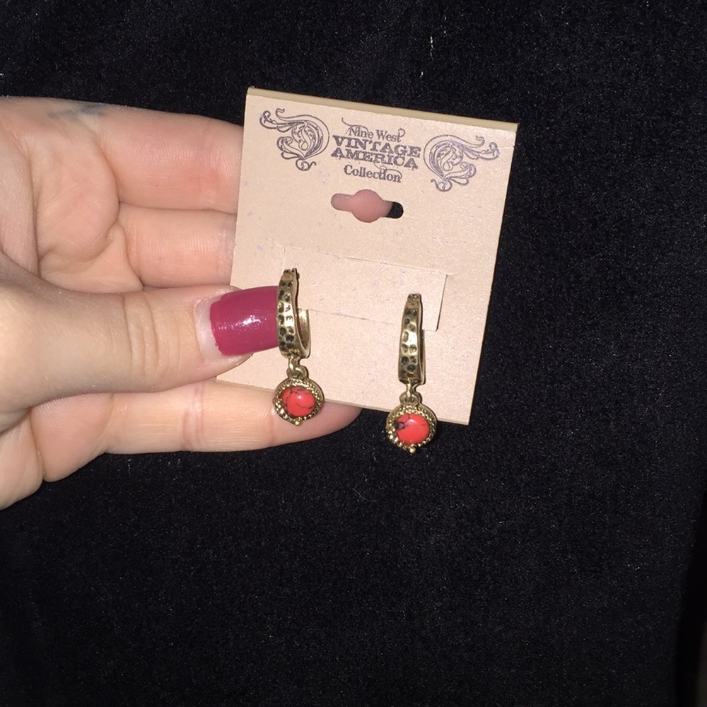 Vintage hoop earrings with a orange stone