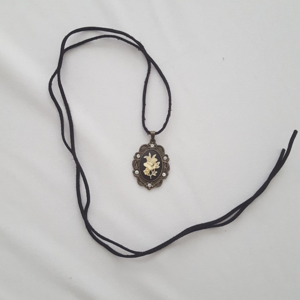 Butterfly cameo on black suede cord