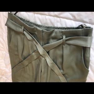 Olive green women’s trousers.